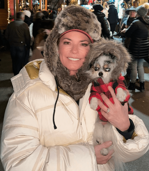 Shania Twain with her dog in 2023 celebrity dogs