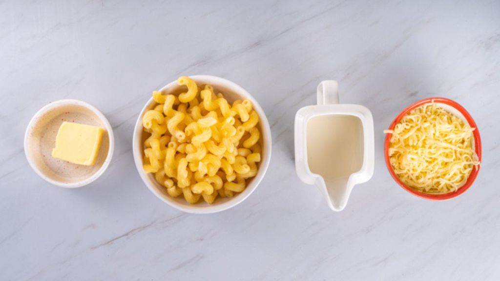 ingredients to make microwave mac and cheese, including milk, pasta and cheese