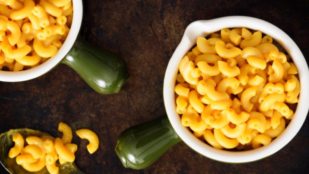 microwave mac and cheese in green mini pots with spoon