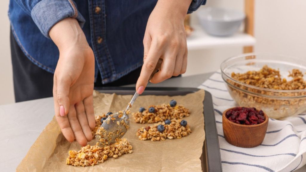 Woman making healthy oat energy bars instead of the oatzempic diet