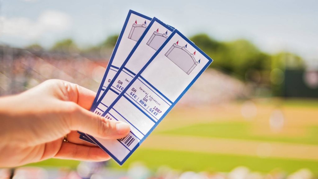 father's day gifts: USA, Maine, Portland, Close-up of hand holding tickets at stadium -