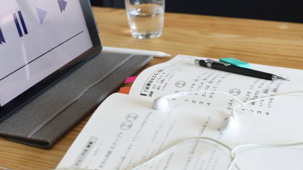 father's day gifts: Japonese language Listening homework above a table with an tablet and earphones