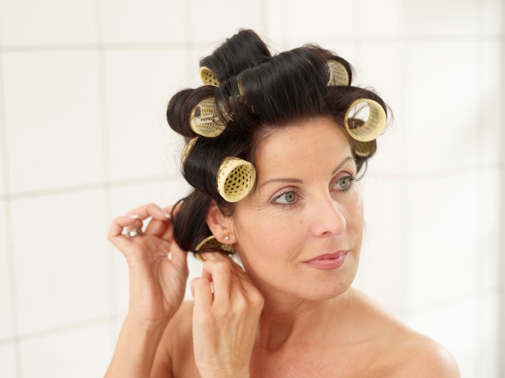 mature woman with rollers in hair