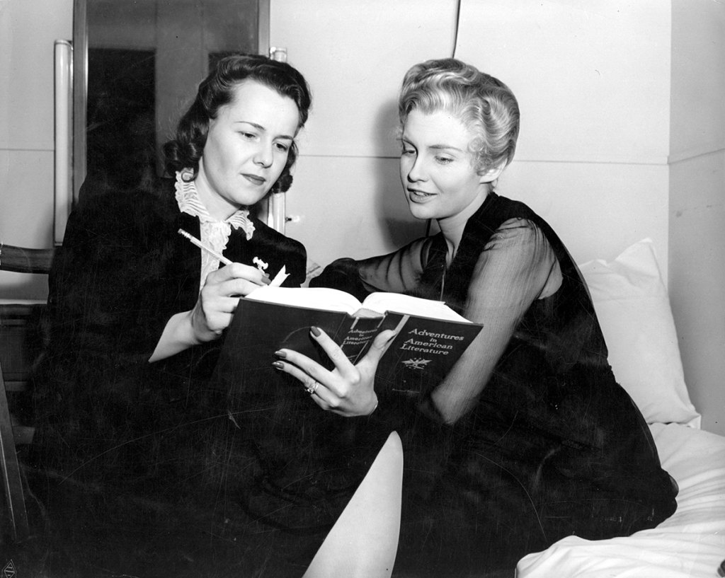 Joan Leslie, the stage name of Joan Brodel,  is 17 years old but made up as a woman of 50. She is on the set of Warner Brothers 'Yankee Doodle Dandy', taking lessons from Beth Clopton, her teacher. 