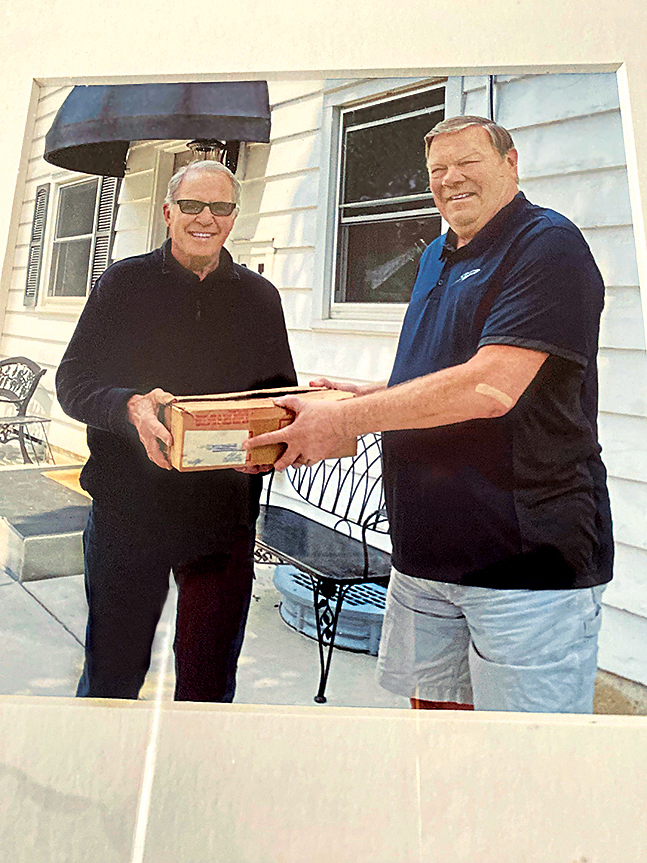 Peter (left) proudly hand-delivered the box of medals to fellow soldier John (right)