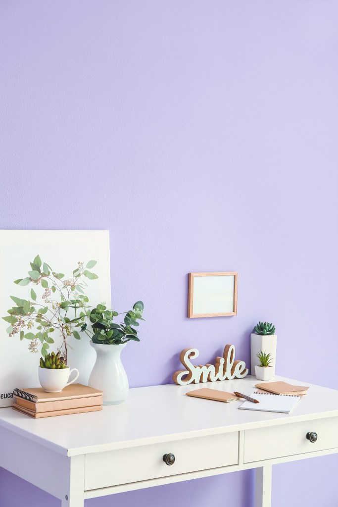 Home office with periwinkle wall 