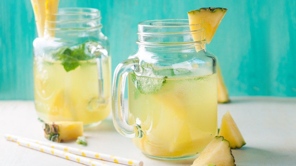 Glasses filled with pineapple-flavored water made with skinny syrups