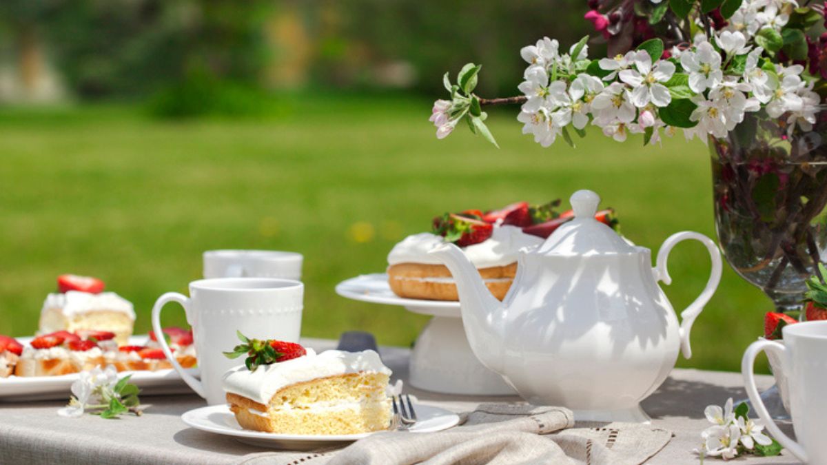 outside tea party table scape filled with bridgerton-inspired recipes
