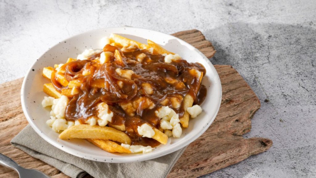 Canadian poutine in white bowl 