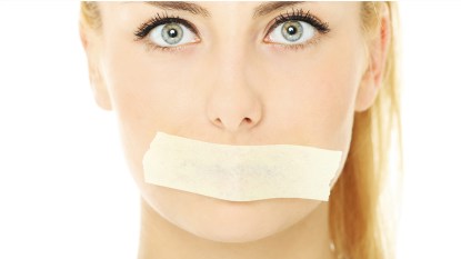 Woman with mouth tape over her mouth