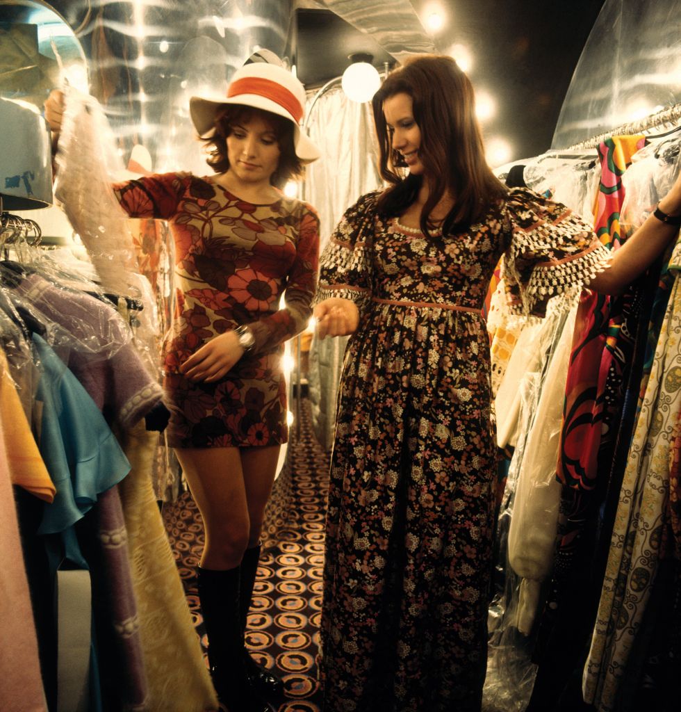Two women looking at dresses in 'Stop the Shop', King's Road, Chelsea, London, 1971