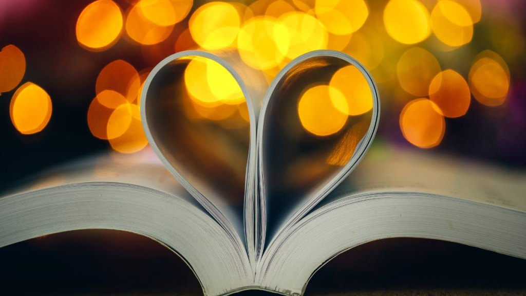 Book page decorate to heart shape with celebration bokeh light for love and romance of valentines day concept