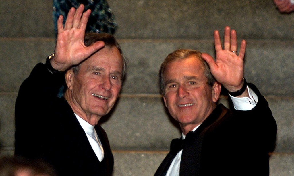 After spending the evening attending inaugural parties all around Washington, DC., US President-elect George W. Bush (R) is met at Blair House by his father, former US President George Bush late January, 2001: Real Presidents on Film