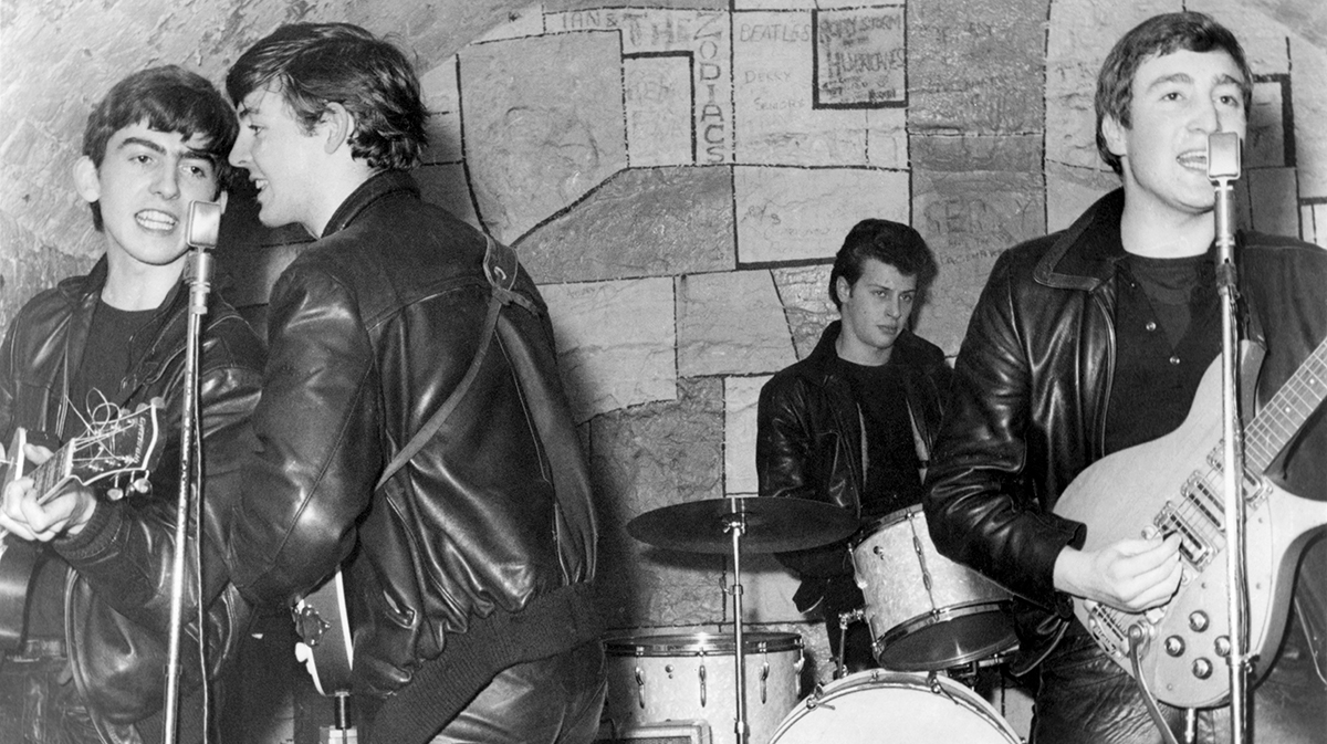 George Harrison, Paul McCartney, Pete Best and John Lennon performing as The Beatles