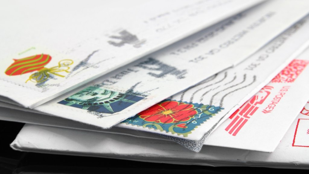 Letters with postage stamps after the price of stamps was increased in 2025