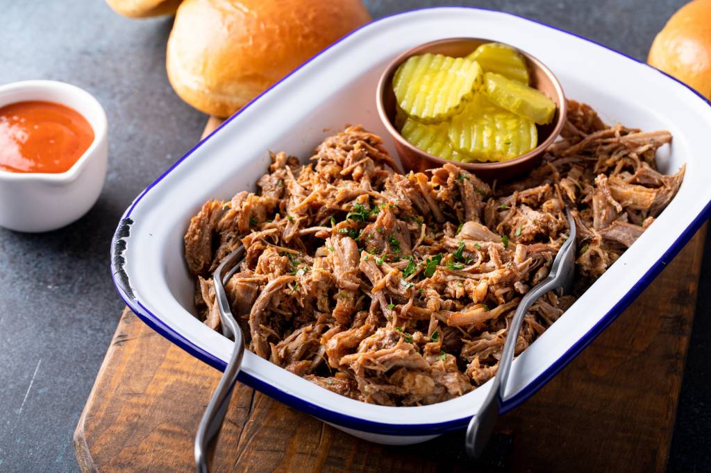 Shredded smoked pork shoulder with condiments