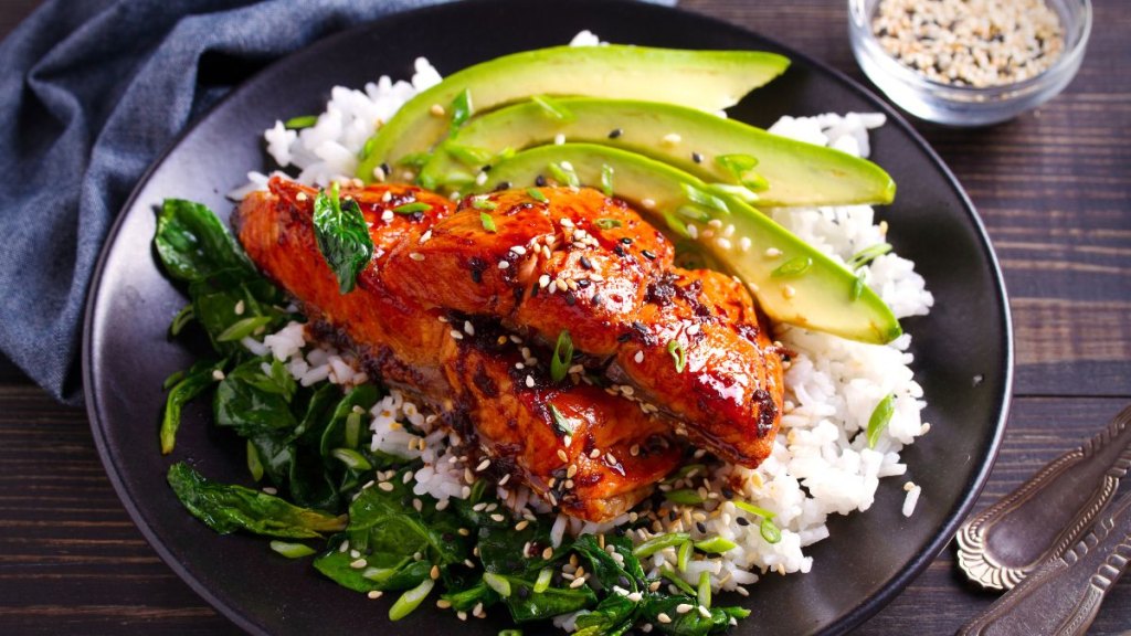 Salmon in honey-soy glaze with rice, spinach and avocado. horizontal: menopause belly