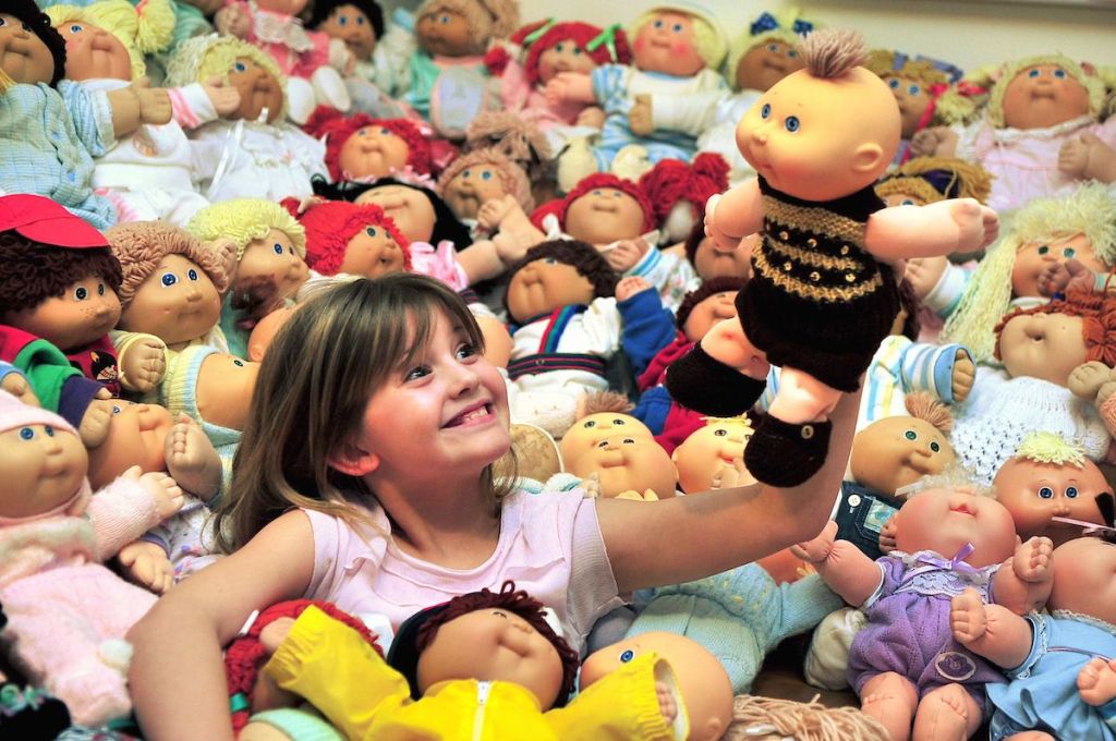 9-year-old Ebony Creed poses with her grandmother's collection of 133 Cabbage Patch Kids in 2012