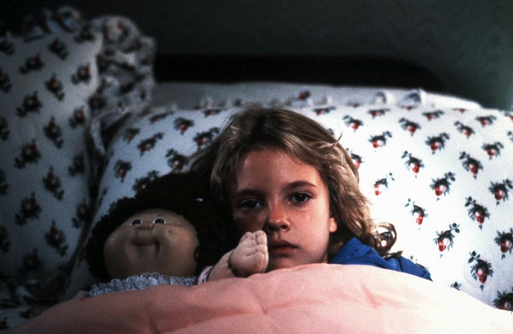 Drew Barrymore with a Cabbage Patch Kid in Firestarter (1984)