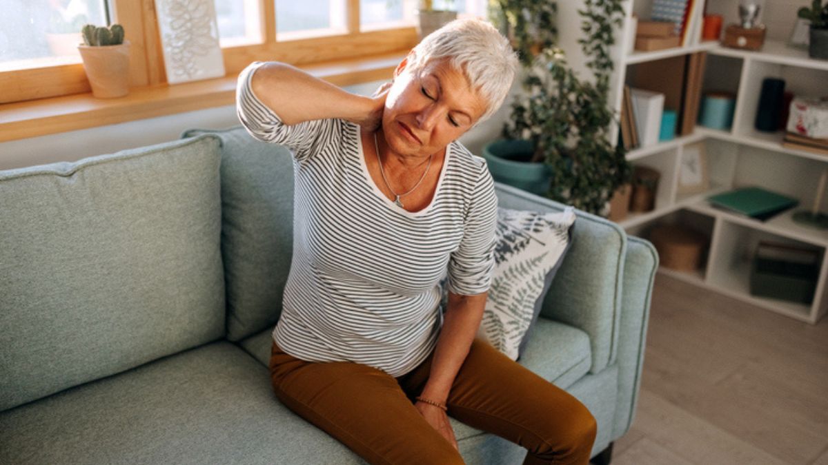 mature woman experiencing symptoms of stiff person syndrome