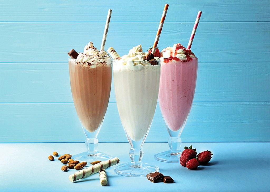 Three boozy milkshakes topped with whipped cream