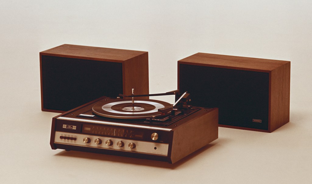 '70s record player and speakers on white background