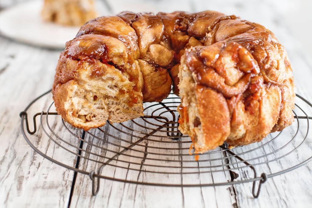 shortcut monkey bread with piece cut out on wire cooling rack