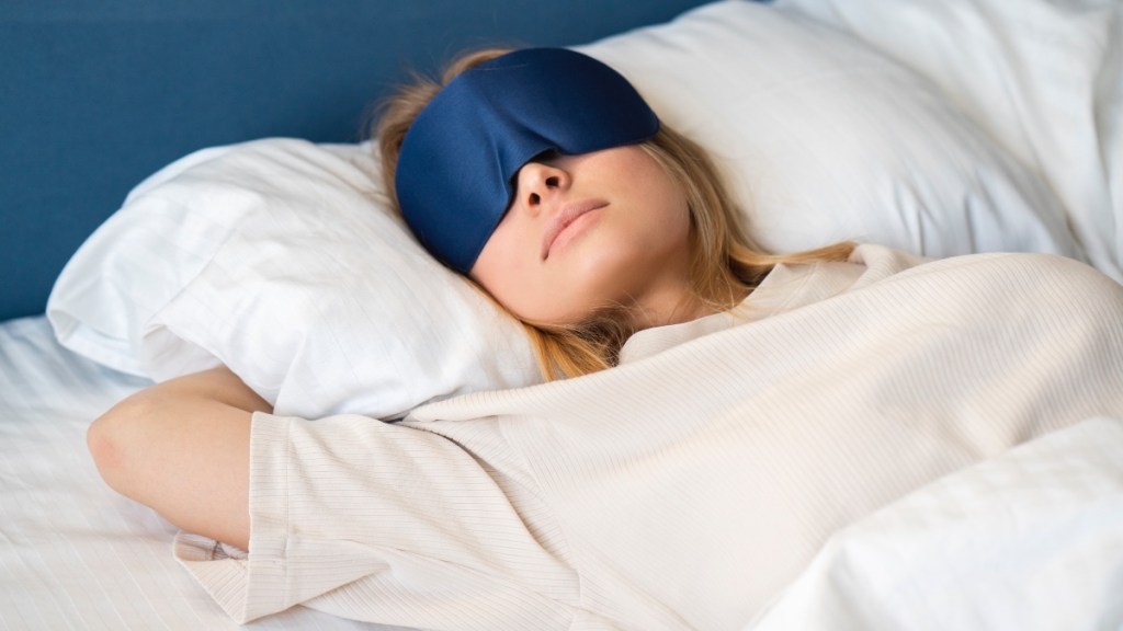 Woman in a sleep mask during the summer heat