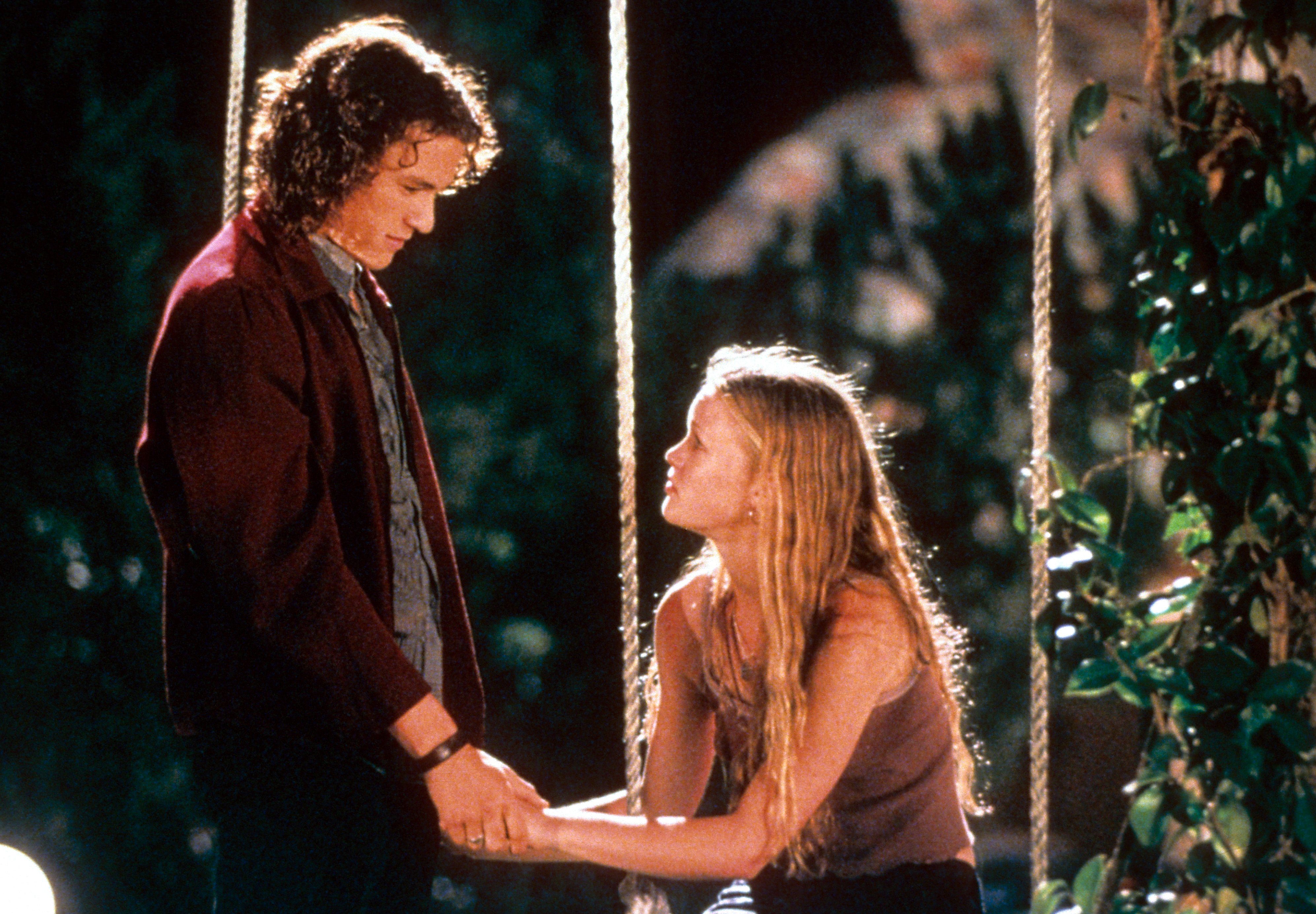 guy holding girls hands