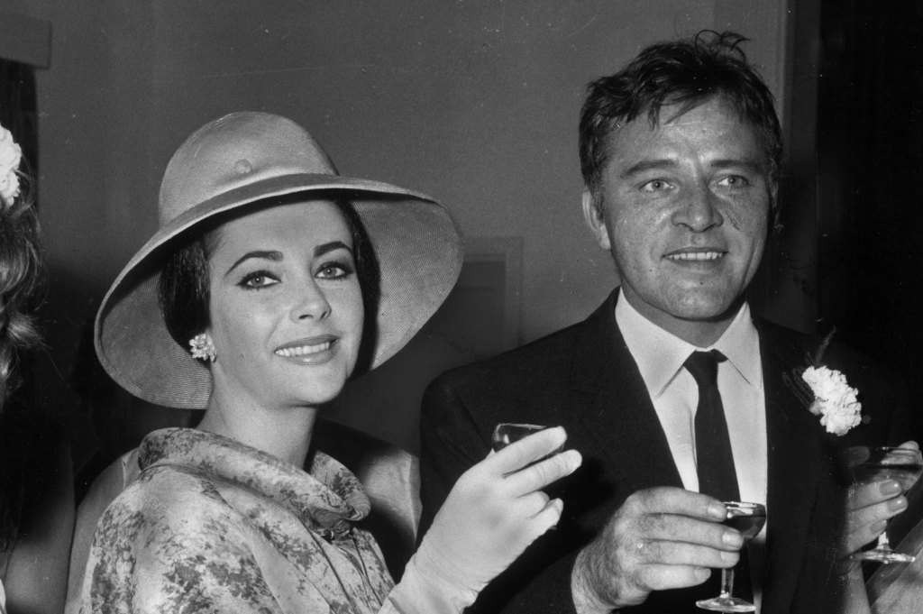 man and woman cheersing; old hollywood couples