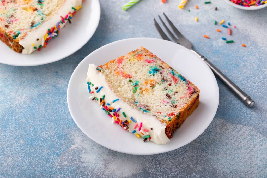 Cake made with melted ice cream and rainbow sprinkles on a plate