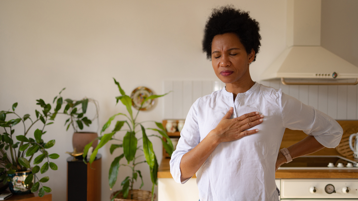 woman holding her chest