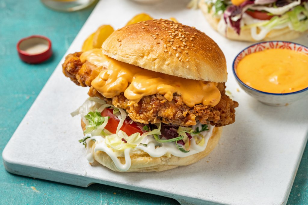 fried chicken sandwich with homemade chick-fil-a sauce recipe on side