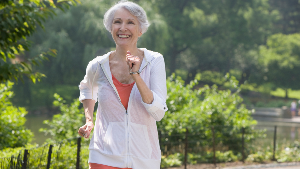 woman walking outside smiling
