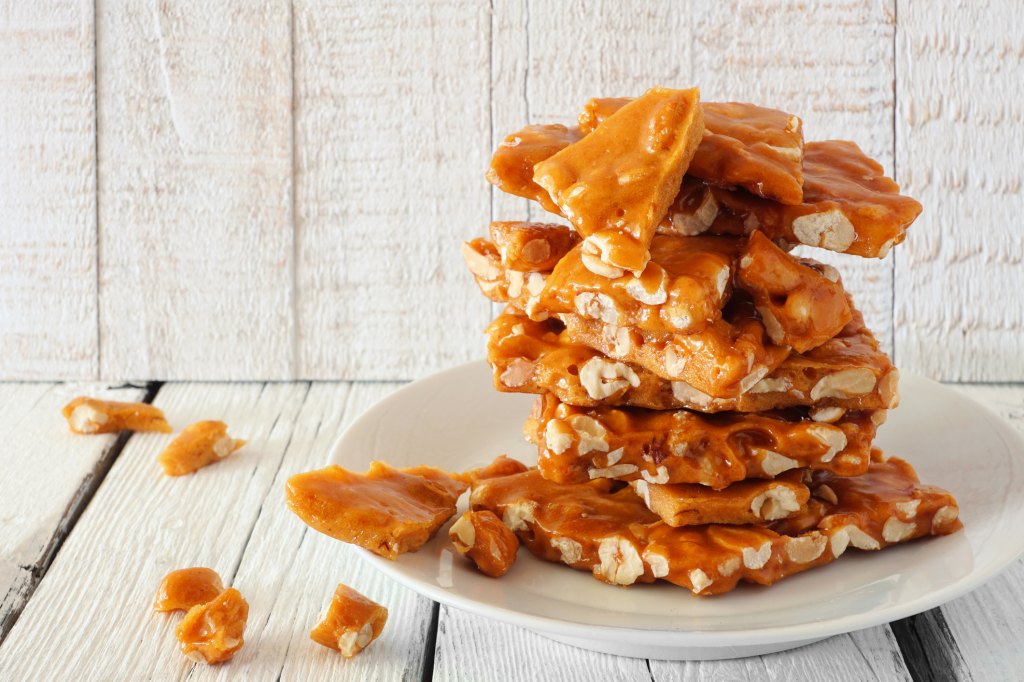 stack of homemade peanut brittle for gifting