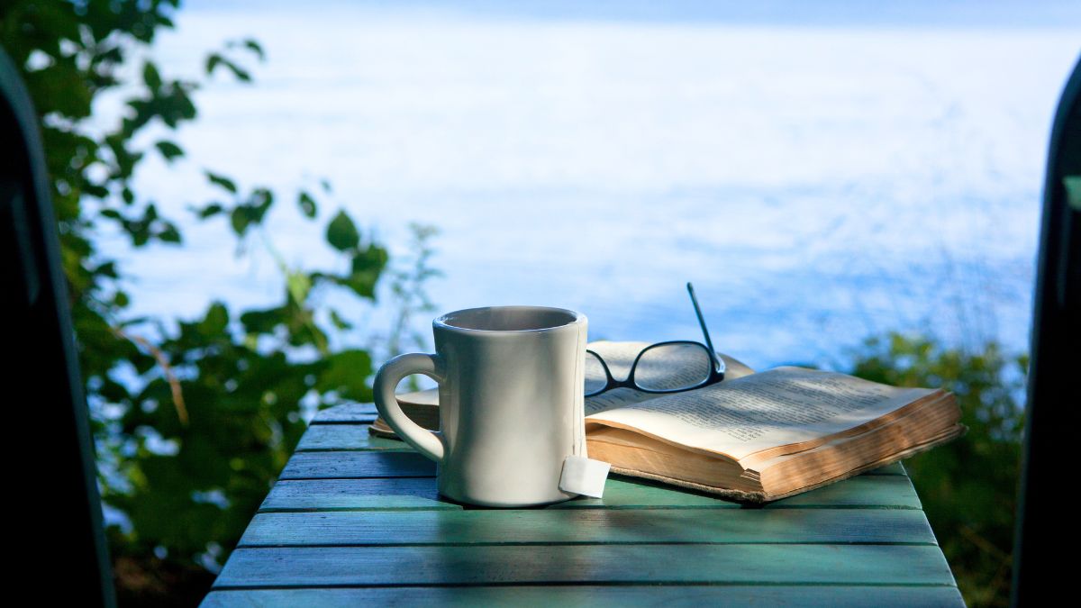 summer-camp-books: Hot beverage ,book, eyeglasses, and a incredible view of Moosehead lake and Mount Kineo in Maine, USA
