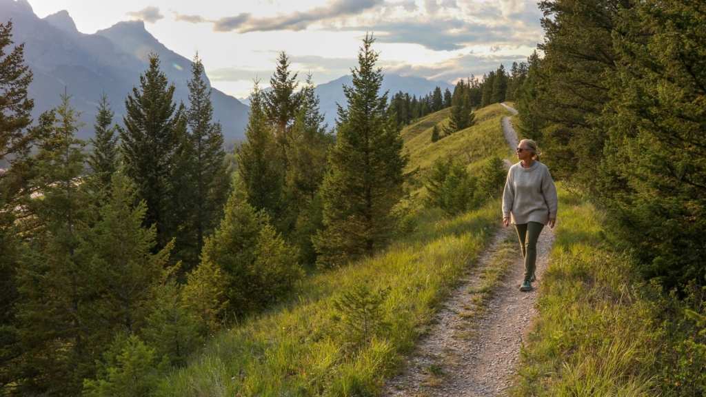 A mature woman following a walking plan for weight loss outdoors in nature
