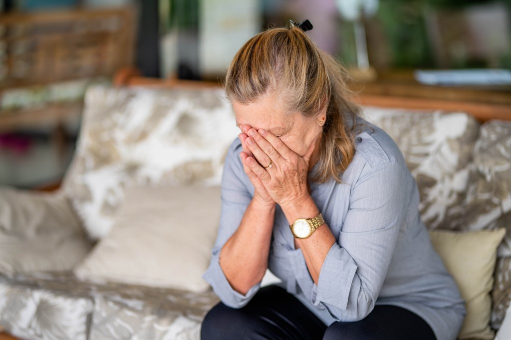 mature woman experiencing increased heart rate and anxiety