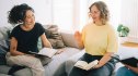 Two women reading together