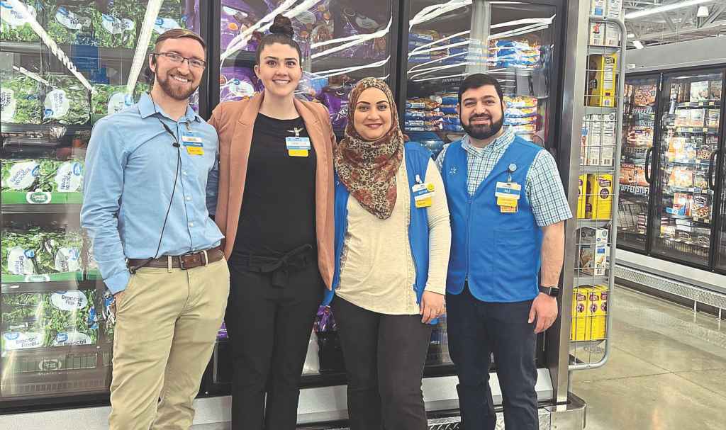 Vanessa (second from left) with assistant manager Jacob Armstrong, Maryam and Ali