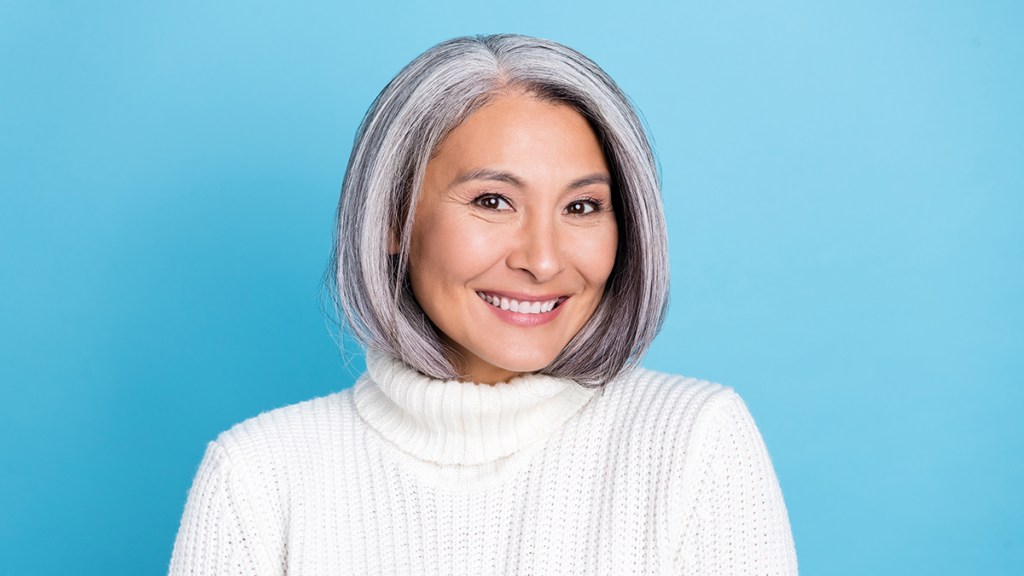 Portrait of an Asian woman who is going gray gracefully