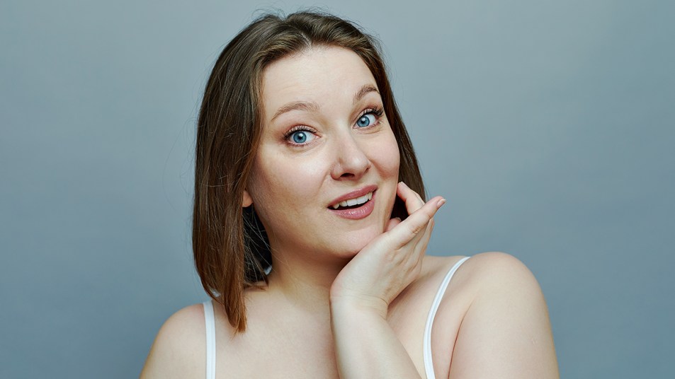 Woman looking a bit bloated and wondering about improving her kidney function naturally