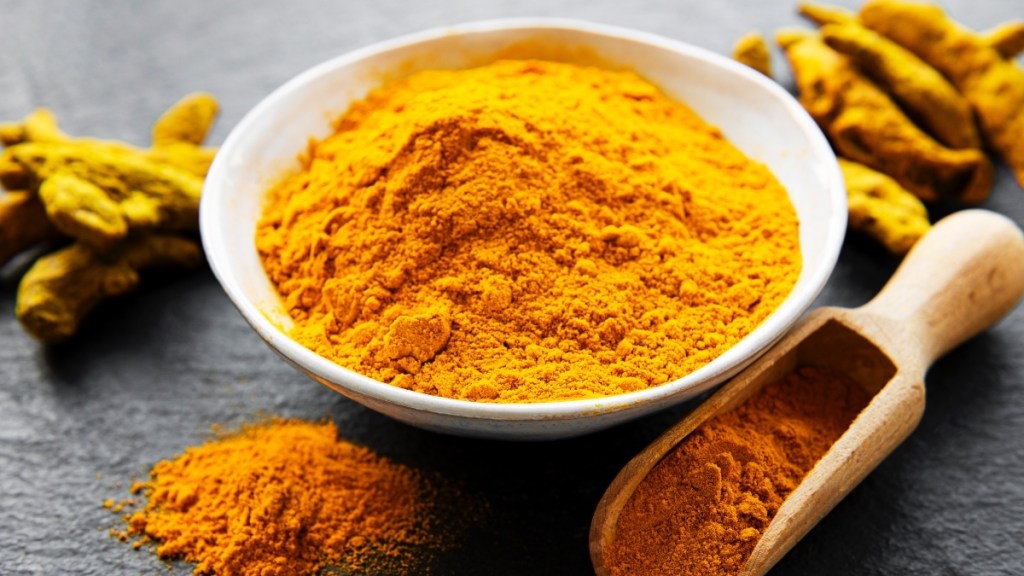 A bowl of ground turmeric