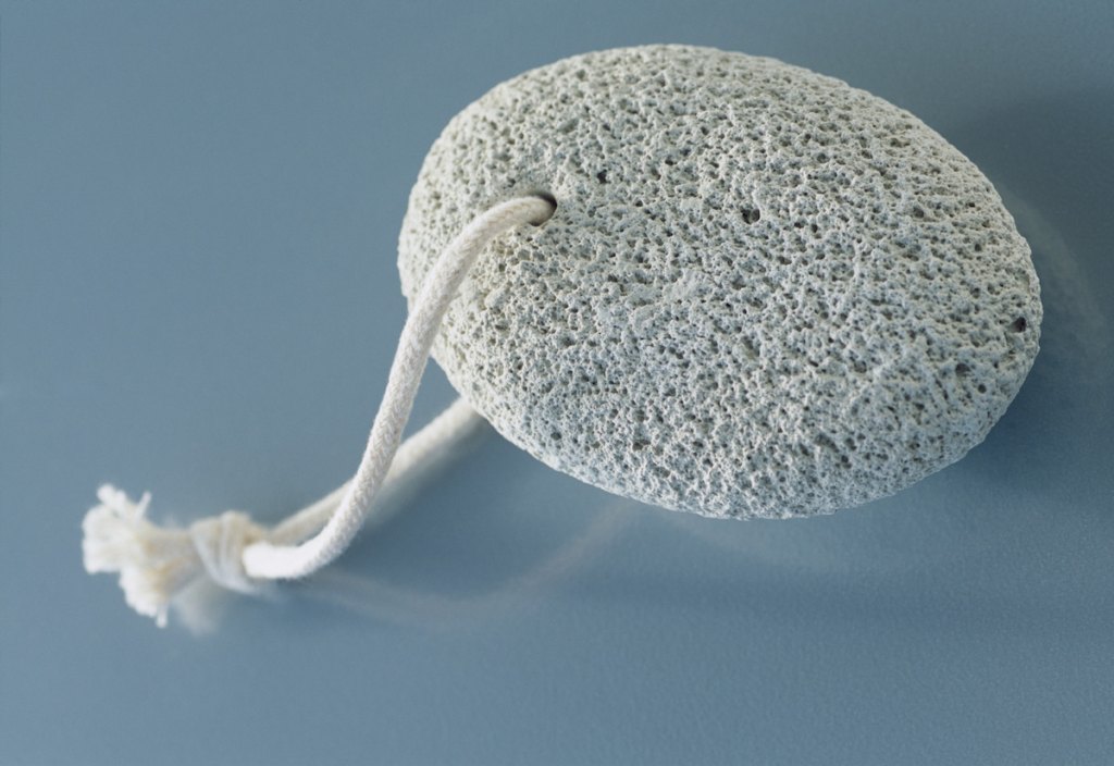 Pumice stone on blue background