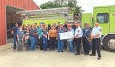 Sam (left) with his wife, Chief Hardin and grateful fire department volunteers