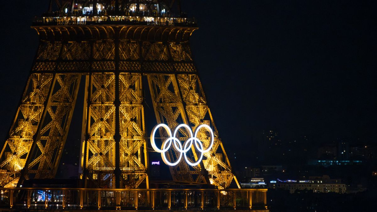 Close-up of the Olympic rings illuminated on the Eiffel Tower by night, Paris, France, 31 July 2024