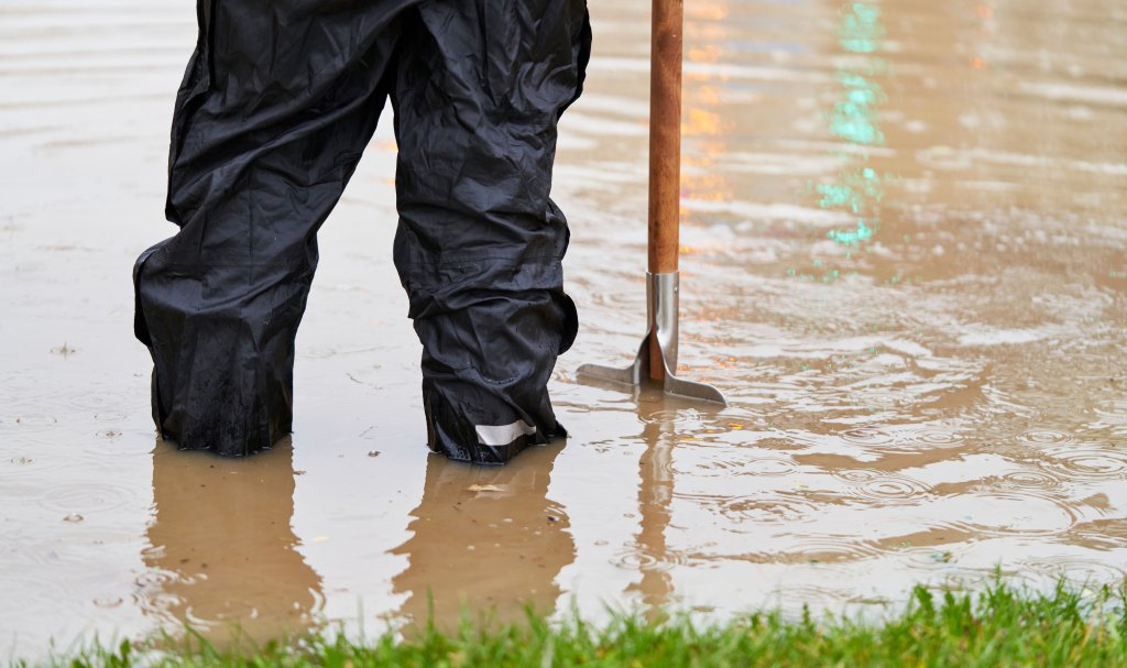 man standing in floods