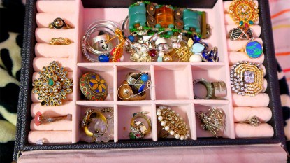 jewelry box overflowing with colorful costume jewelry