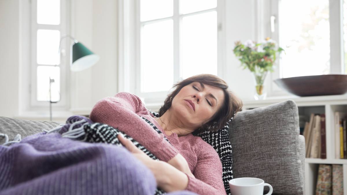 Woman sleeping on sofa