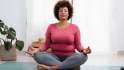 woman at home practicing guided imagery for pain